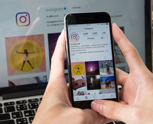 Picture of mobile device showing Instagram and Instagram on Desktop